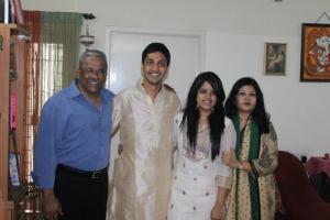 With her family, her husband, daughter and son-in-love. (Yes you read it right, she refuses to call him son in law!!!!)